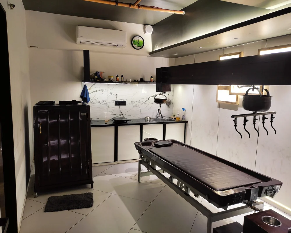 Traditional Kerala Panchakarma treatment room at Divine Ayurveda Hospital